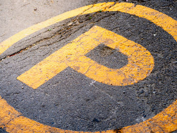 High angle view of arrow sign on road