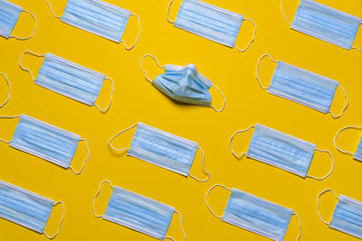 High angle view of yellow shoes on table