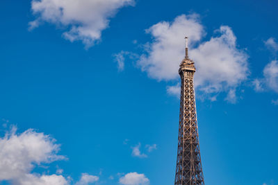 Low angle view of building against cloudy sky