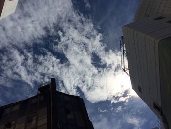 Low angle view of building against cloudy sky