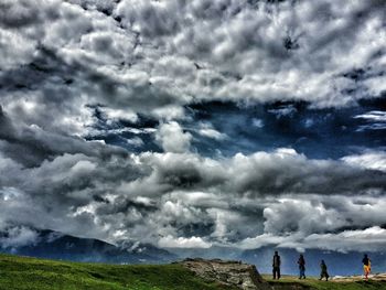 Scenic view of landscape against cloudy sky