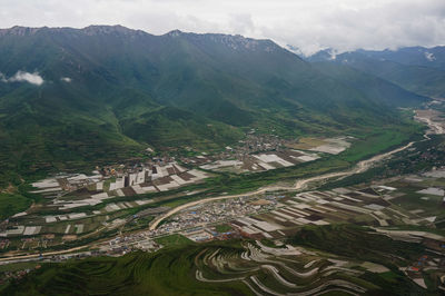 High angle view of farms against sky