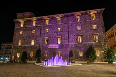 Illuminated building at night