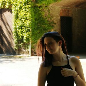 Young woman standing in park