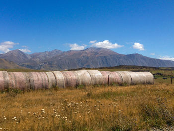 Scenic view of field against blue sky