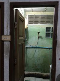 Building seen through door of house