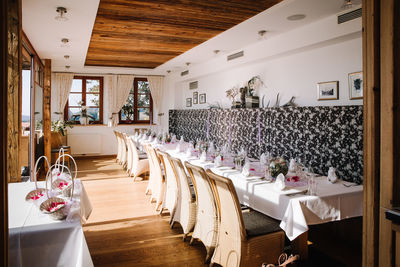 Empty chairs and tables in restaurant