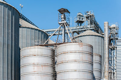 Low angle view of factory against sky