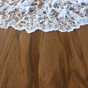 High angle view of surf on beach