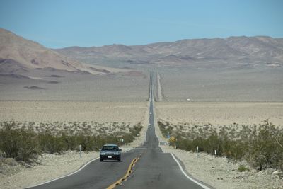 Cars on road in desert