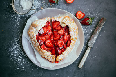 Directly above shot of strawberry tart on table