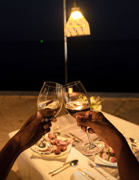 Cropped hand of woman holding wineglass