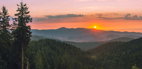 Scenic view of mountains against sky during sunset