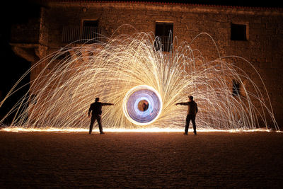 Woman jumping at night