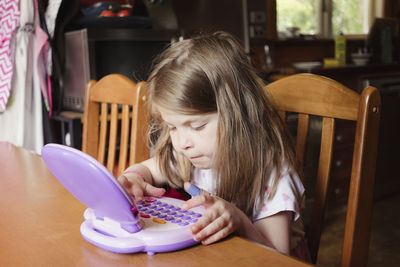 Girl sitting on table