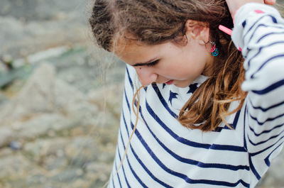 Close-up of teenage girl looking down