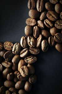 Close-up of coffee beans on table