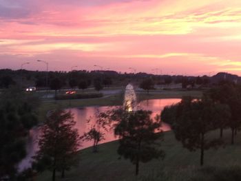 Scenic view of lake against sky at sunset