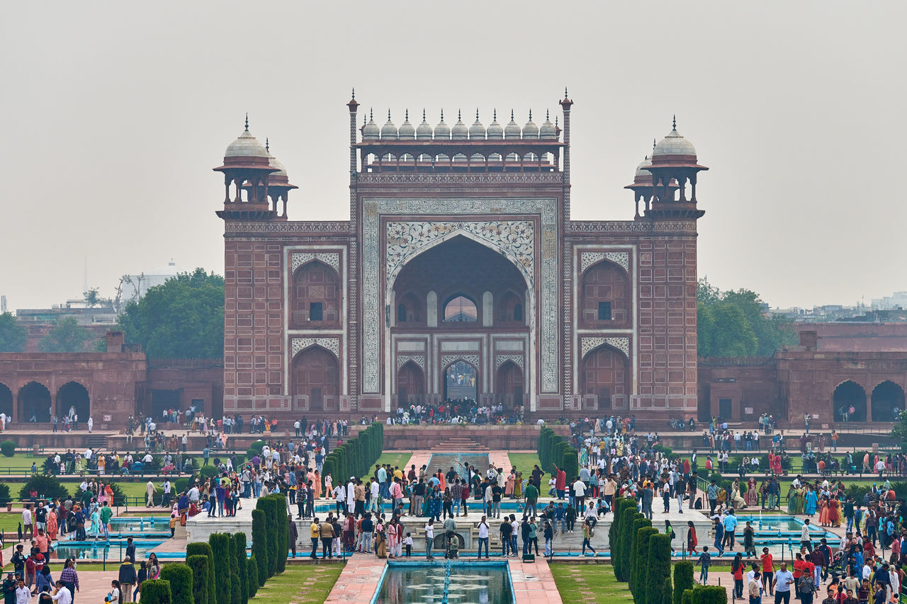 architecture, travel destinations, landmark, crowd, large group of people, built structure, arch, travel, group of people, tourism, history, the past, nature, city, building exterior, monument, memorial, sky, outdoors, lifestyles, tourist, religion, town square, ancient