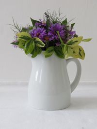 Close-up of flower vase on table