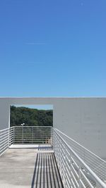 Staircase against clear blue sky