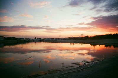 Scenic view of lake against sky during sunset