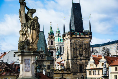 Statue by charles bridge against sky