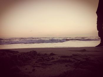 Scenic view of beach against sky during sunset