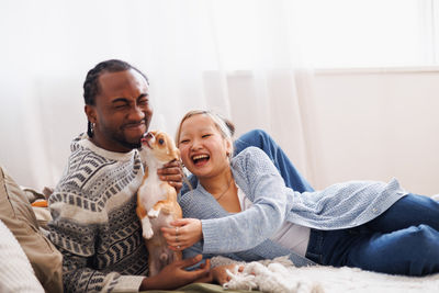 Portrait of senior couple sitting at home