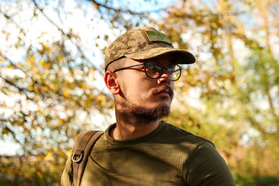 Portrait of young man wearing hat
