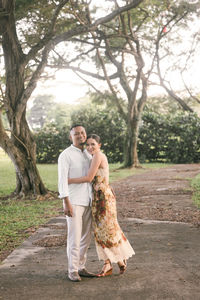 Rear view of woman standing in forest