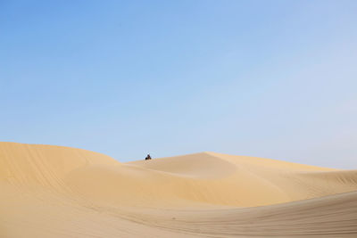 Scenic view of desert against clear sky