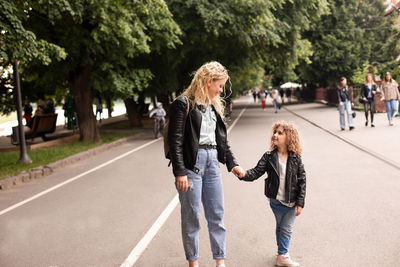 Women walking on street in city