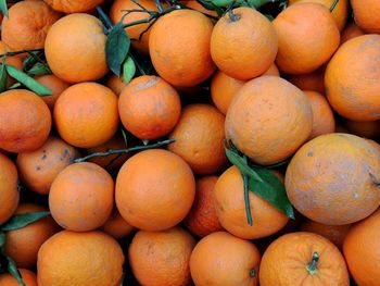 Full frame shot of oranges at market stall