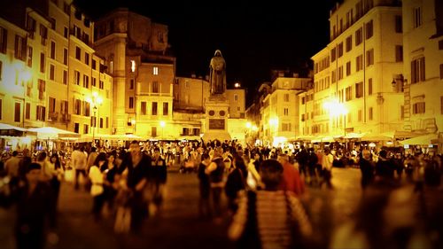 Crowd on illuminated city at night