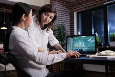 Portrait of young businesswoman working at office