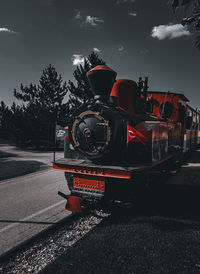 Train on railroad track against sky