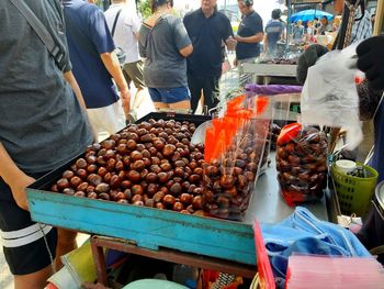 People at market stall