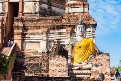 Statue of temple outside building