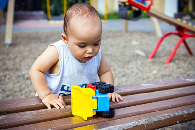 Portrait of cute boy playing with toy