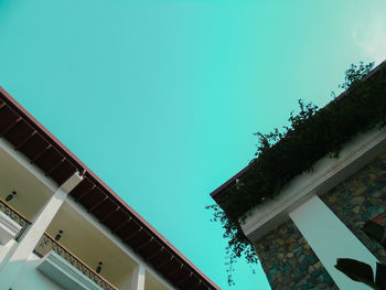 Low angle view of building against clear blue sky