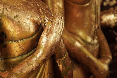 Buddha statue with gold leaf adornment at wat yai chai mongkhon temple, ancient city of ayudhaya,