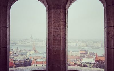 Buildings in city against sky