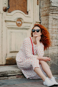 Young woman sitting outdoors