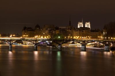 Bridge over river at night