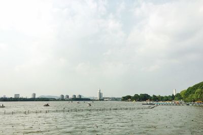 Scenic view of sea against cloudy sky