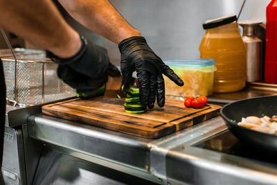 Midsection of man preparing food at home