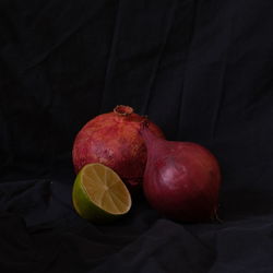 Close-up of vegetables on table against black background