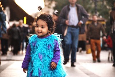 Smiling cute girl wearing costume while standing outdoors