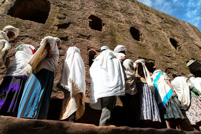 Low angle view of people wearing traditional clothing